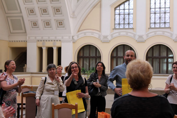 Sándor Kálai distributing gifts to Anna Gural-Migdal and her team
