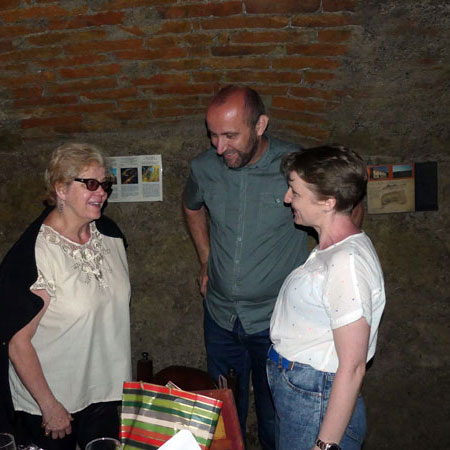 Anna Gural-Migdal receiving a birthday gift from Anna Keszeg and Sándor Kálai