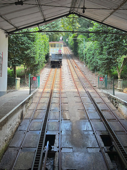 The group boards the water-powered funicular to the top of the staircase