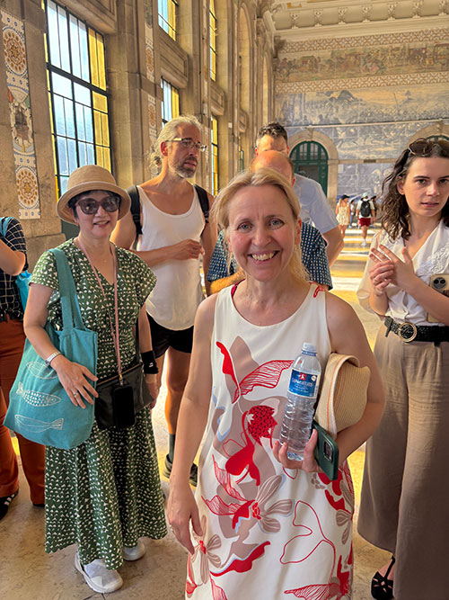 Guide Célia Vieira (center) ends the tour at the Porto São Bento train station